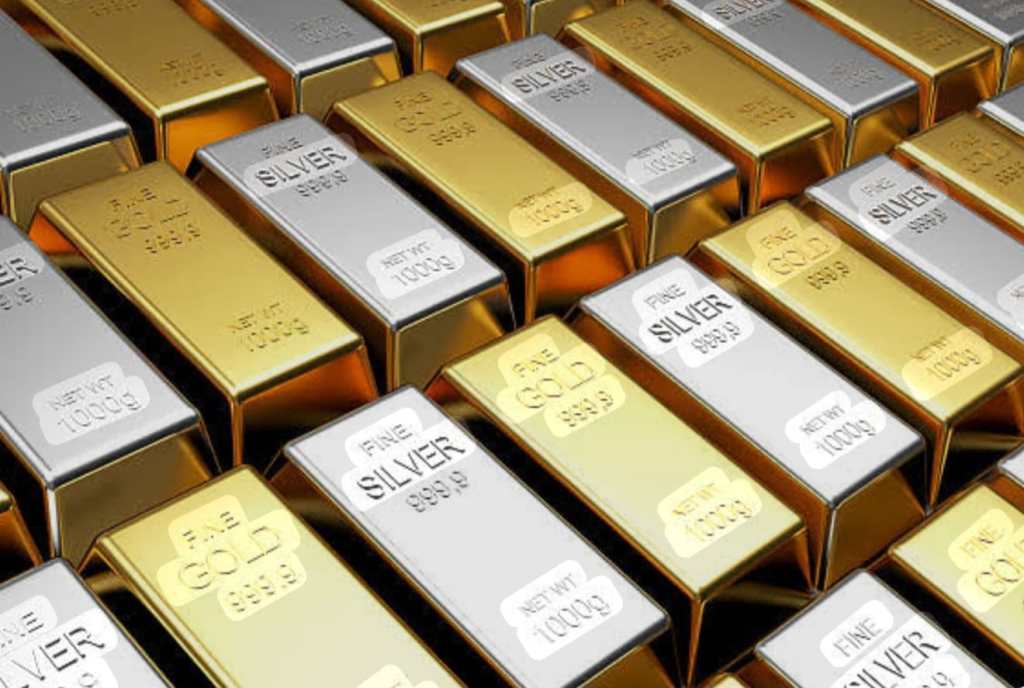 Stacks of gold and silver bars displayed together, showcasing their shiny surfaces and weight labels.